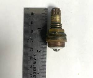 Cartridge out of the valve beside a ruler