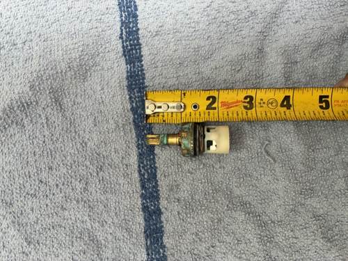 Stem next to a tape measure showing overall length