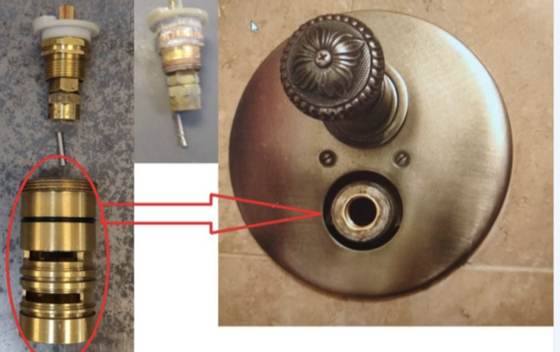 Half of a thermostatic cartridge left inside the valve body